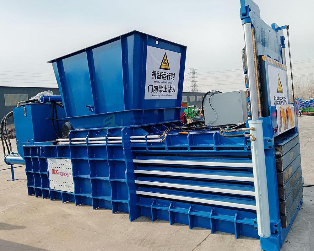 Robust horizontal baling machine built for industrial applications.